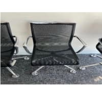 Alias meeting room chair upholstered in black mesh on chrome frame